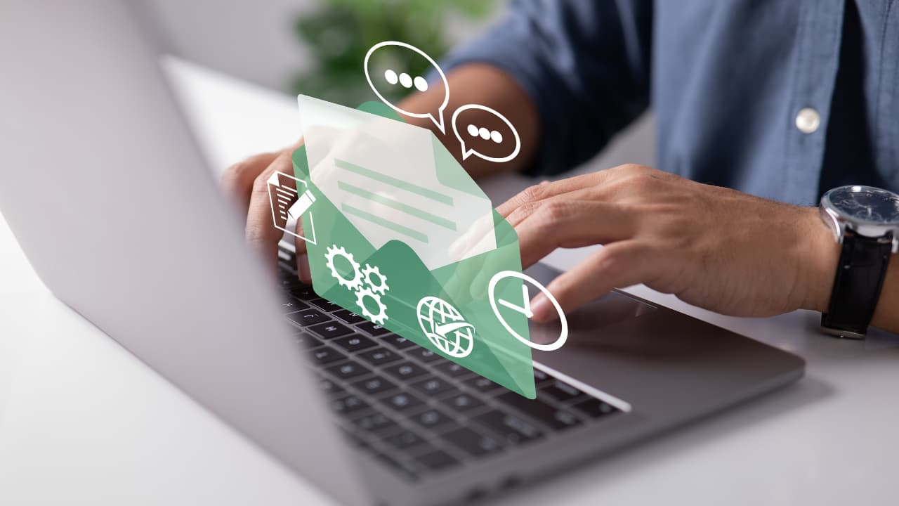 Hands typing on a laptop with overlay graphics of an envelope and icons representing communication and technology, suggesting digital interaction.