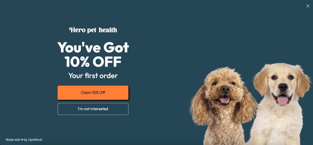 Ad for Hero Pet Health offers 10% off first order. Features cheerful poodle and golden retriever against a blue background. Buttons for claiming or declining offer.