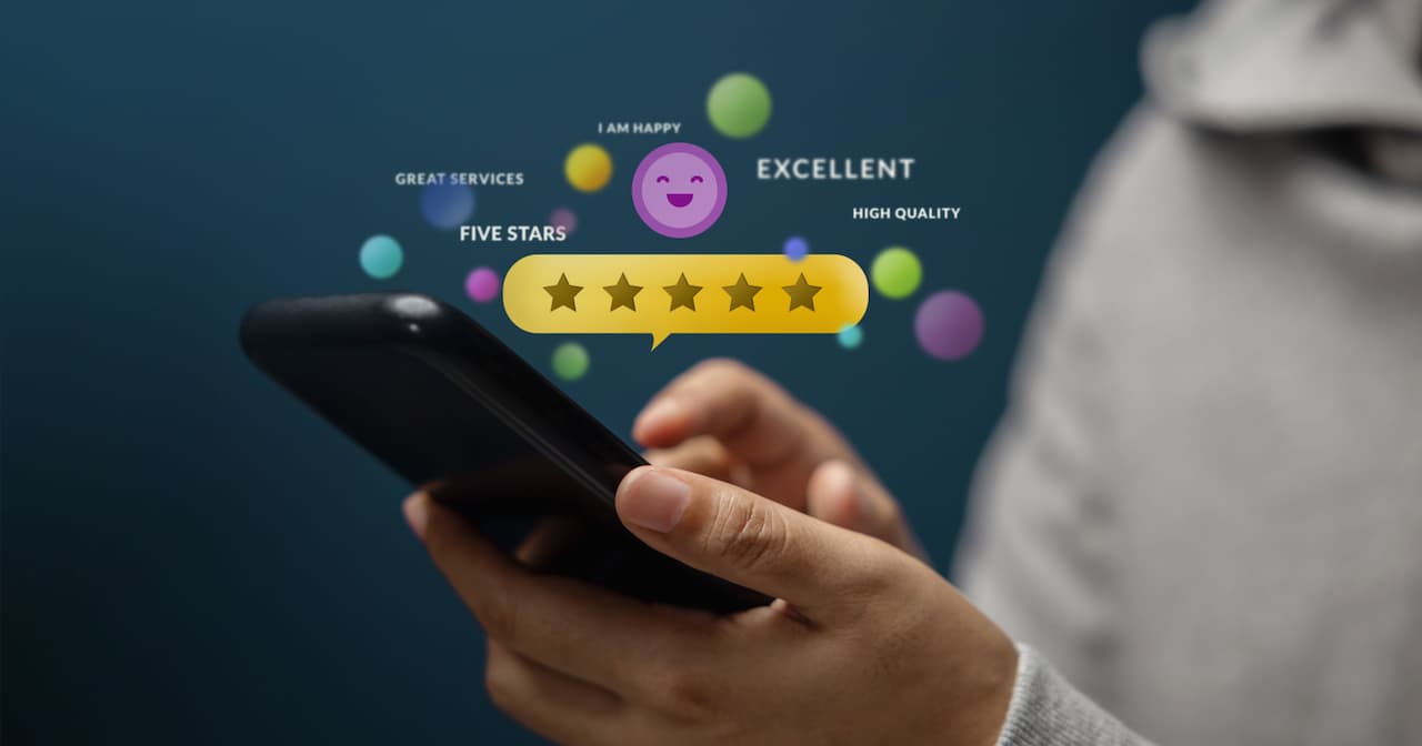 A person using a smartphone with floating icons and text indicating positive reviews: five stars, "excellent," "high quality," and a smiling emoji.